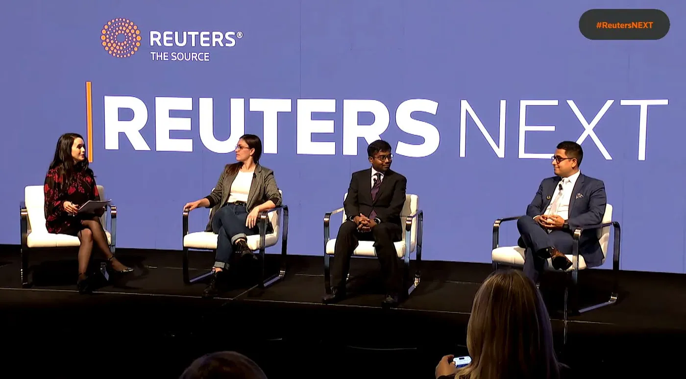 Panelists on stage at the Reuters NEXT conference, including a Pani representative