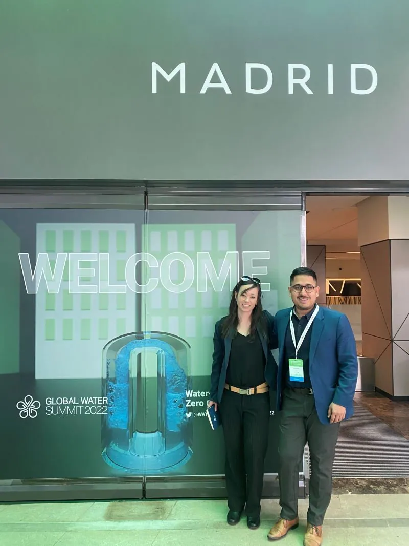 Two people from Pani standing next to the Welcome sign at Global Water Summit 2022